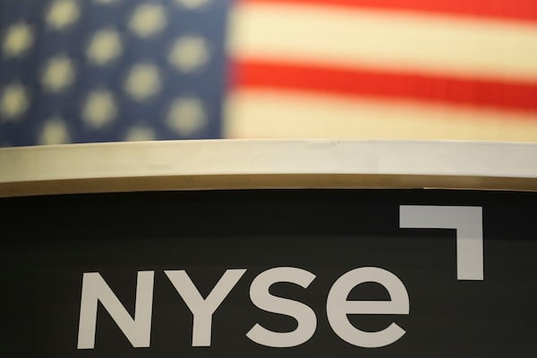 FILE - An NYSE sign is displayed on the floor at the New York Stock Exchange in New York, Thursday, Jan. 2, 2025. (AP Photo/Seth Wenig, File)