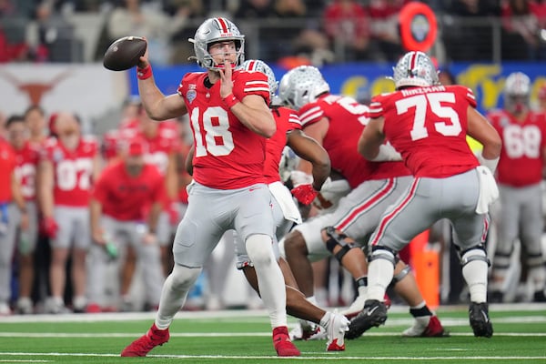 Ohio State quarterback Will Howard (18) passes against Texas during the first half of the Cotton Bowl College Football Playoff semifinal game, Friday, Jan. 10, 2025, in Arlington, Texas. (AP Photo/Julio Cortez)