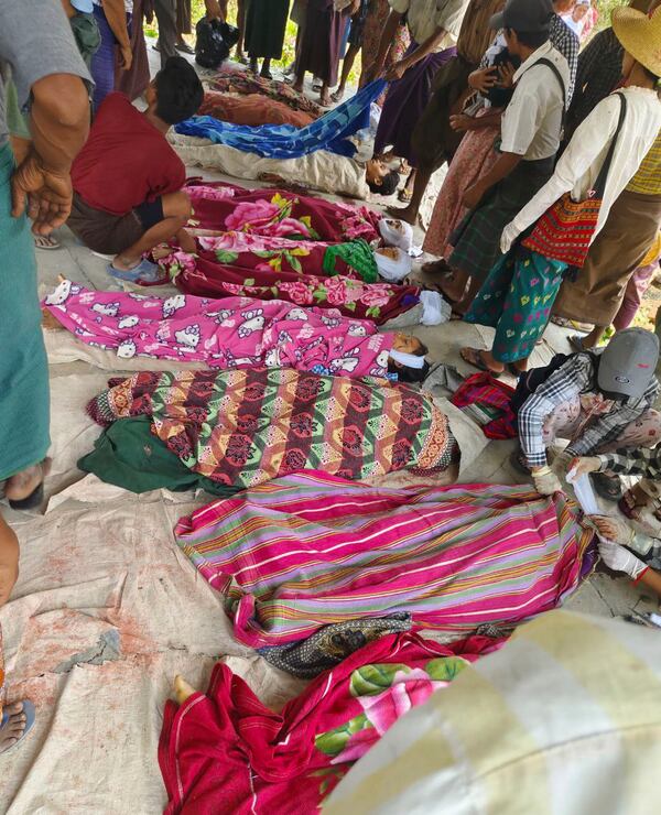 EDS NOTE GRAPHIC CONTENT- Bodies of victims, killed in an alleged hit by a military airstrike, are laid on the ground in Ohe Htein Twin village in Tabayin township, also known as Depayin in Sagaing region, Myanmar, Monday, May 12, 2025. (White Depeyin People Defence Force via AP)