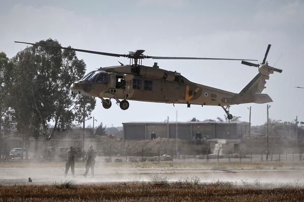 A military helicopter carrying relatives of Israeli-American soldier Edan Alexander lands ahead of his scheduled release from Hamas captivity in Gaza, in Reim, near the Gaza border, southern Israel, Monday, May 12, 2025.(AP Photo/Maya Alleruzzo)