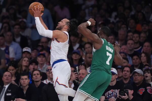 New York Knicks' Jalen Brunson, left, drives past Boston Celtics' Jaylen Brown (7) during the second half of Game 6 in the Eastern Conference semifinals of the NBA basketball playoffs Friday, May 16, 2025, in New York. (AP Photo/Frank Franklin II)