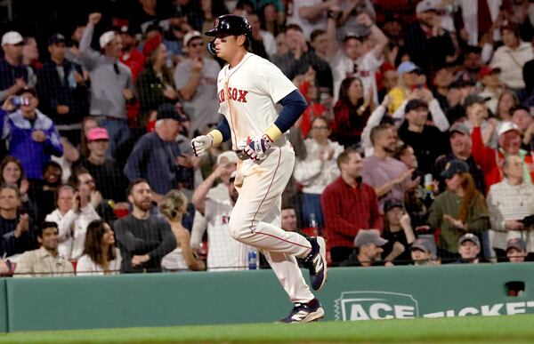 Boston Red Sox's Triston Casas runs to the plate after hitting a three-run homerun during the eighth inning of a baseball game against the Seattle Mariners, Wednesday, April 23, 2025, in Boston. (AP Photo/Mark Stockwell)