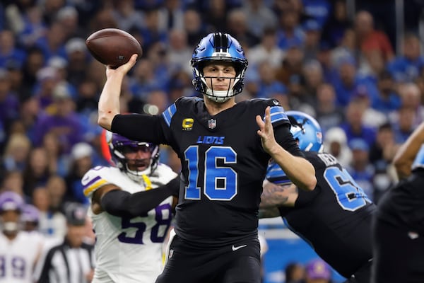 Detroit Lions quarterback Jared Goff (16) throws against the Minnesota Vikings during the first half of an NFL football game Sunday, Jan. 5, 2025, in Detroit. (AP Photo/Rey Del Rio)