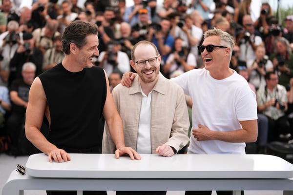 Pedro Pascal, from left, director Ari Aster and Joaquin Phoenix pose for photographers at the photo call for the film 'Eddington' at the 78th international film festival, Cannes, southern France, Saturday, May 17, 2025. (Photo by Scott A Garfitt/Invision/AP)