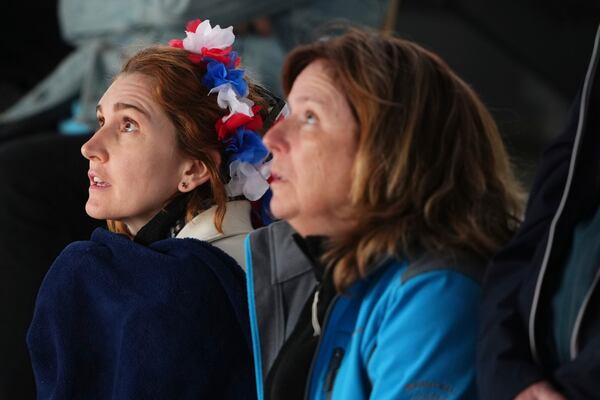 FILE - Fans watch the first round match of the French Tennis Open between France's Arthur Fils and Chile's Nicolas Jarry, at the Roland-Garros stadium, in Paris, Monday, May 26, 2025. (AP Photo/Lindsey Wasson, File)