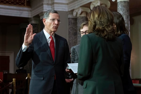 Vice President Kamala Harris, right, holds a ceremonial swearing-in for Sen. John Barrasso, R-Wyo., at the Capitol in Washington, Friday, Jan. 3, 2025. (AP Photo/Jose Luis Magana)