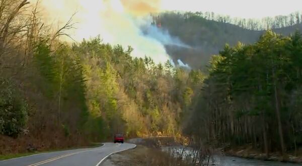 Smoke from the wildfires fill the sky in Polk County, N.C., on Saturday, March 22, 2025. (WLOS-TV via AP)