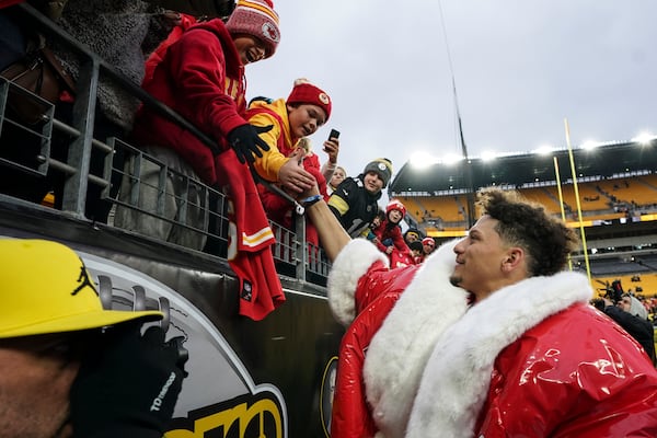 Fans cheer for Kansas City Chiefs quarterback Patrick Mahomes after an NFL football game against the Pittsburgh Steelers, Wednesday, Dec. 25, 2024, in Pittsburgh. (AP Photo/Matt Freed)