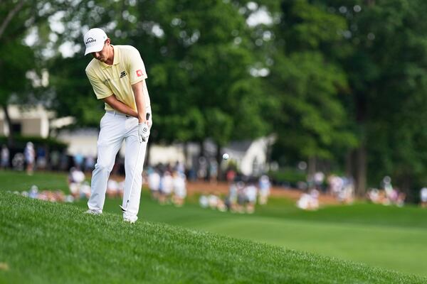 Matthew Fitzpatrick, of England, chips to the green on the 14th hole during the second round of the PGA Championship golf tournament at the Quail Hollow Club, Friday, May 16, 2025, in Charlotte, N.C. (AP Photo/George Walker IV)