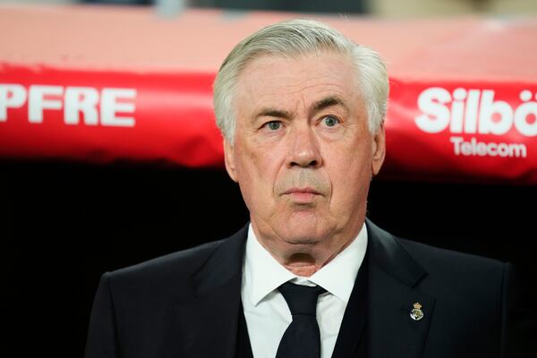 Real Madrid's head coach Carlo Ancelotti waits for the start of the Spanish Copa del Rey final soccer match between Barcelona and Real Madrid at Estadio de La Cartuja stadium in Seville, Spain, Saturday, April 26, 2025. (AP Photo/Jose Breton)