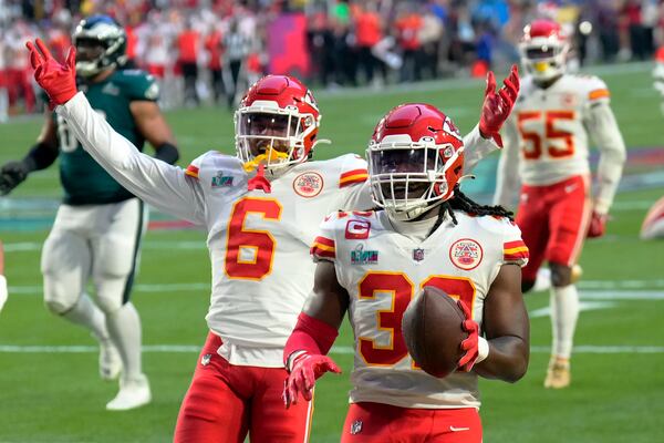 FILE _ Kansas City Chiefs linebacker Nick Bolton, right, celebrates after returning fumble by Philadelphia Eagles quarterback Jalen Hurts (1) for a touchdown during the first half of the NFL Super Bowl 57 football game, Sunday, Feb. 12, 2023, in Glendale, Ariz. (AP Photo/Ross D. Franklin, File)