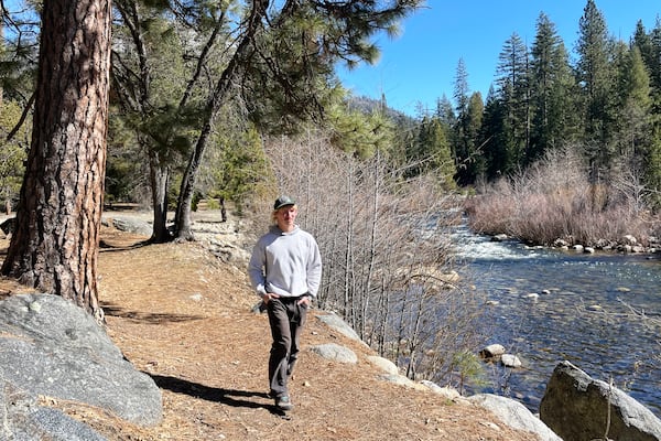 Aleksander Chmura, who was dismissed from his job as a park custodian, walks on the grounds Thursday, Feb. 20, 2025, in Yosemite National Park, Calif. (AP Photo/Haven Daley )