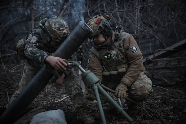 In this photo taken on March 16, 2025 and provided by Ukraine's 24th Mechanized Brigade press service, Ukrainian soldiers fire 120mm mortar towards Russian army positions near Chasiv Yar, Donetsk region, Ukraine, Sunday, March 16, 2025. (Oleg Petrasiuk/Ukraine's 24th Mechanized Brigade via AP)