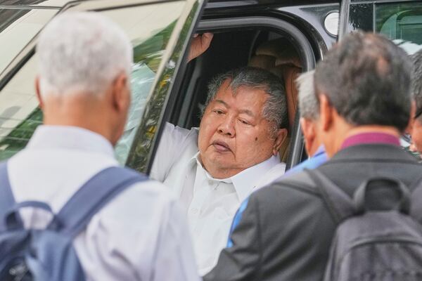 Premchai Karnasuta, the president of Italian-Thai Development Co arrives at Bang Sue Police Station in Bangkok, Thailand, Friday, May 16, 2025 to surrender to police on criminal negligence charges for the collapse of a Bangkok high-rise during a March 28 earthquake. (AP Photo/Sakchai Lalit)