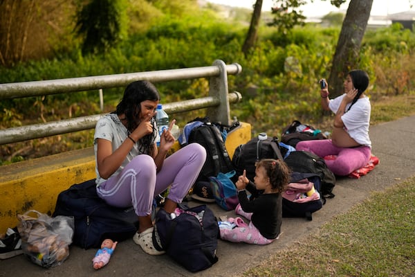 Venezuelan migrant Yajaidys Toro plays with her daughter Alexa Garcia in Panama City, Sunday, March 2, 2025. The migrants are returning from southern Mexico after giving up on reaching the U.S., a reverse flow triggered by the Trump administration's immigration crackdown. (AP Photo/Matias Delacroix)