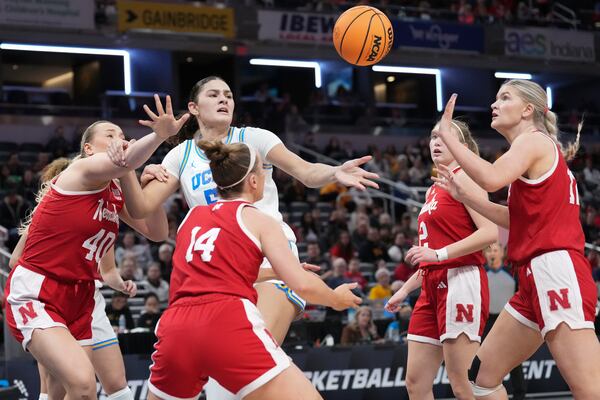 UCLA center Lauren Betts (51) battles with Nebraska players for the ball during the second half of an NCAA college basketball game in the quarterfinals of the Big Ten Conference tournament in Indianapolis, Friday, March 7, 2025. (AP Photo/AJ Mast)