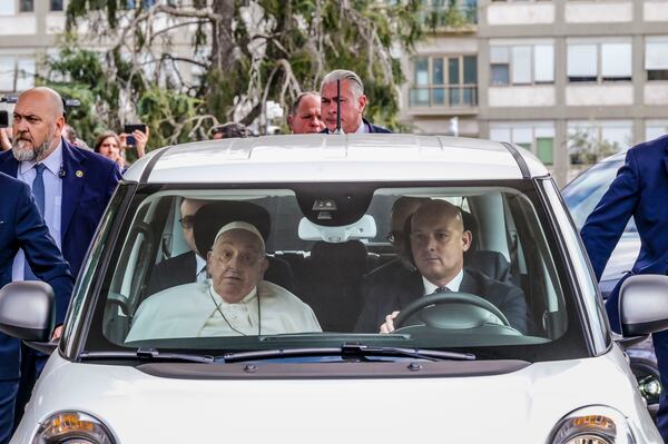 Pope Francis leaves in a car the Agostino Gemelli Polyclinic in Rome, Sunday, March 23, 2025, where he was admitted on Feb. 14 for bilateral pneumonia. (AP Photo/Marco Ravagli)