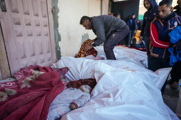 The body of 6-month-old Mohammad Abu Libda lies among other victims of overnight Israeli army strikes at multiple locations in the central Gaza Strip at Al-Aqsa Martyrs Hospital in Deir al-Balah, Friday, Jan. 3, 2025. According to Al-Aqsa Martyrs Hospital, 30 people, including 10 women and 7 children, were killed in several attacks overnight in central Gaza. (AP Photo/Abdel Kareem Hana)