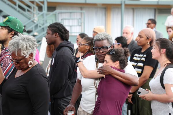 Tameka Greer, center left, and Dory Lerner, center right, embrace during a community rally in honor of Tyre Nichols, Thursday, May 8, 2025, in Memphis, Tenn. (AP Photo/Nikki Boertman)