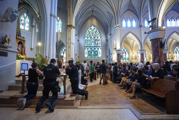 People attend mass at Holy Rosary Cathedral on a provincial day of mourning for the victims of the vehicle-ramming attack at the Filipino community's Lapu Lapu Day festival last week, in Vancouver, on Friday, May 2, 2025. (Darryl Dyck/The Canadian Press via AP)