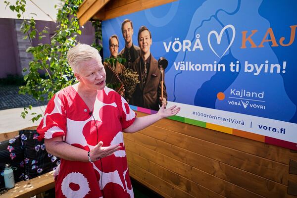 Organizer Dorothee Schulte-Basta talks to the Associated Press in front of a Finnish pop-up sauna promoting the Swedish Eurovision competitor KAJ from Finland during the 69th Eurovision Song Contest week, in Basel, Switzerland, Wednesday, May 14, 2025. (AP Photo/Martin Meissner)