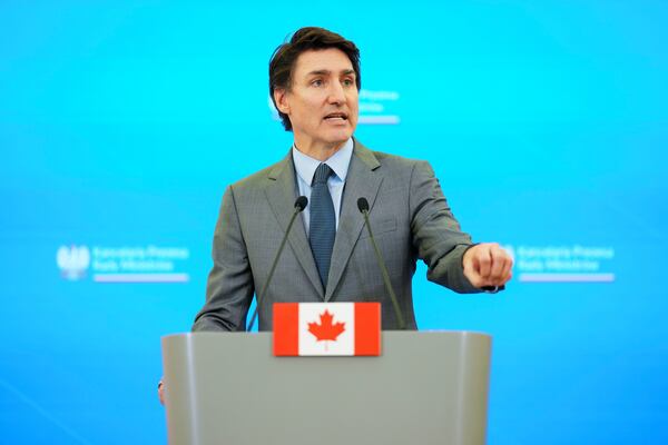 Prime Minister Justin Trudeau takes part in a joint press conference with Polish Prime Minister Donald Tusk (not shown) at the Chancellery of the Prime Minister in Warsaw, Poland on Tuesday, Jan. 28, 2025. (Sean Kilpatrick /The Canadian Press via AP)