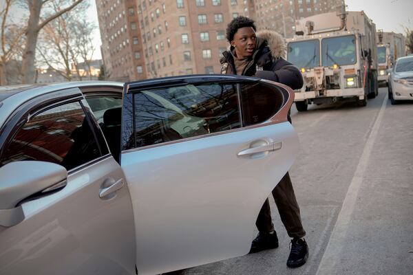 Camden Lee, 16, gets in an Uber to go to school, Tuesday, Jan. 28, 2025, in the Brooklyn borough of New York. (AP Photo/Julia Demaree Nikhinson)