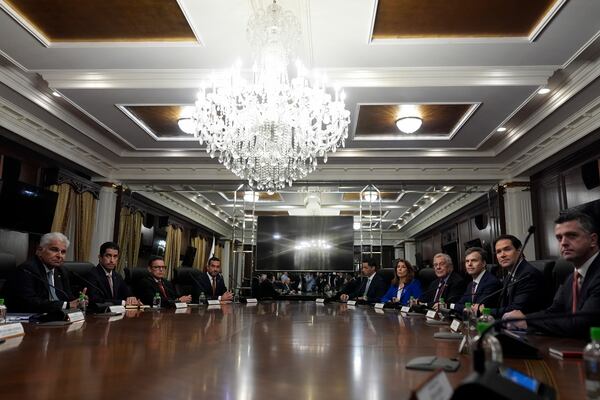 U.S. Secretary of State Marco Rubio, second right, meets with Panamanian President Jose Raul Mulino, left, at the presidential palace in Panama City, Sunday, Feb. 2, 2025. (AP Photo/Mark Schiefelbein, Pool)