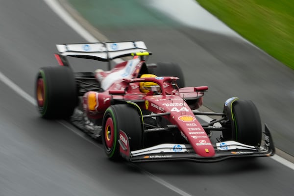 Ferrari driver Lewis Hamilton of Britain steers his car during the Australian Formula One Grand Prix at Albert Park, in Melbourne, Australia, Sunday, March 16, 2025. (AP Photo/Asanka Brendon Ratnayake)