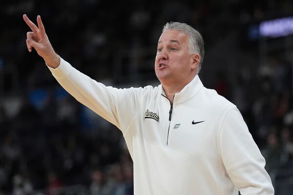 Purdue head coach Matt Painter calls to his players during the first half in the second round of the NCAA college basketball tournament, Saturday, March 22, 2025, in Providence, R.I. (AP Photo/Charles Krupa)