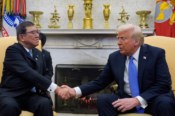 President Donald Trump greets Japanese Prime Minister Shigeru Ishiba in the Oval Office of the White House, Friday, Feb. 7, 2025, in Washington. (AP Photo/Alex Brandon)