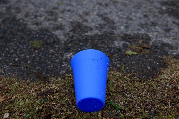 A used Hiccup, a reusable silicone cup, is discarded on the ground before being collected during the PNC Women Run the Cities race on Saturday, May 17, 2025, in Minneapolis. (AP Photo/Ellen Schmidt)