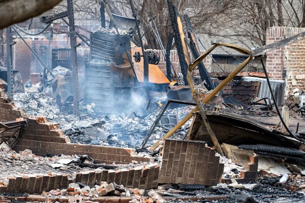 A house still was still smoldering Saturday, March 15, 2025, in Stillwater, Okla., following Friday’s wildfires throughout central Oklahoma. (Jason Elmquist/The News Press via AP)