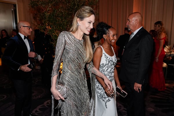 Angelina Jolie, left, and Zahara Marley Jolie arrive at the 82nd Golden Globes on Sunday, Jan. 5, 2025, at the Beverly Hilton in Beverly Hills, Calif. (AP Photo/Chris Pizzello)