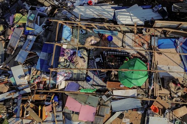 Drone view of destroyed dwellings in Mirereni, Mayotte, Friday, Dec. 20, 2024. (AP Photo/Adrienne Surprenant)