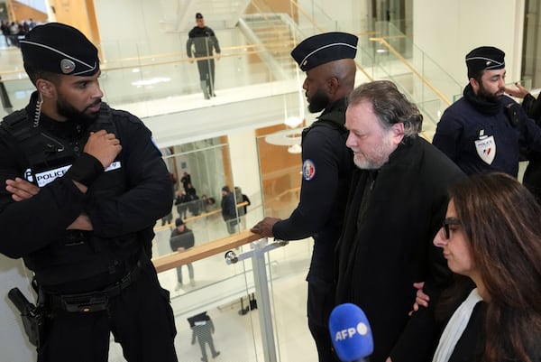 French filmmaker Christophe Ruggia leaves the courtroom in Paris, Monday, Feb. 3, 2025, after he was found guilty of sexual assault on French actor Adèle Haenel when she was between 12 and 15 in the early 2000s, in the country’s first big #MeToo trial. (AP Photo/Aurelien Morissard)