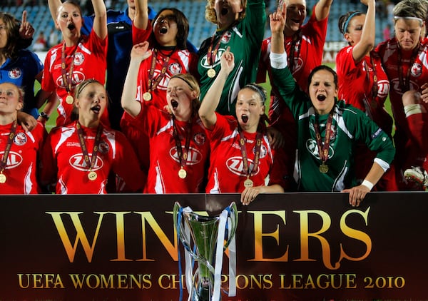 FILE - Turbine Potsdam players celebrate with the trophy after winning UEFA Women's Champions League Final soccer match against Lyon at the Coliseum Alfonso Perez stadium in Getafe, near Madrid, Thursday, May 20, 2010. (AP Photo/Arturo Rodriguez, File)