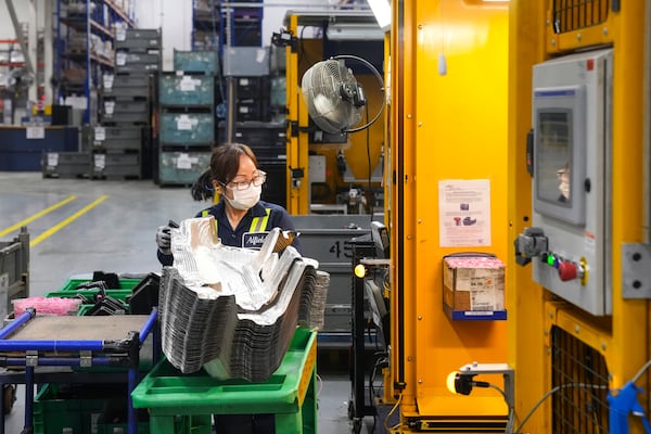 FILE - An employee works on the production line at the Martinrea auto parts manufacturing plant that supplies auto parts to Canada and U.S. plants, in Woodbridge, Ontario, Monday, Feb. 3, 2025. (Chris Young/The Canadian Press via AP, File)