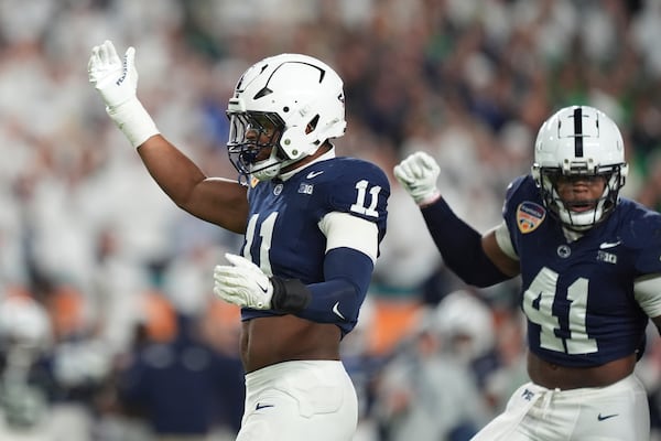 Penn State defensive end Abdul Carter (11) gestures after a play during first half of the Orange Bowl NCAA College Football Playoff semifinal game against Notre Dame, Thursday, Jan. 9, 2025, in Miami Gardens, Fla. (AP Photo/Rebecca Blackwell)