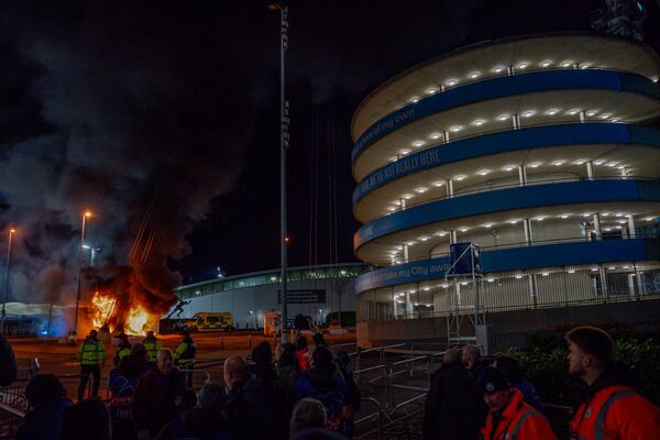 A fire burns at a merchandise kiosk outside the Etihad Stadium before the Champions League opening phase soccer match between Manchester City and Brugge in Manchester, England, Wednesday, Jan. 29, 2025.(AP Photo/Dave Thompson)