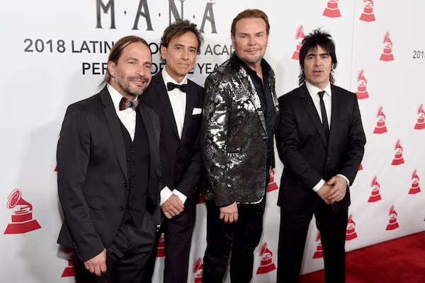 FILE - Sergio Vallin, from left, Juan Calleros, Fher Olvera and Alex Gonzalez, of Mana, appear at the Latin Recording Academy Person of the Year gala in their honor on Nov. 14, 2018. (Photo by Chris Pizzello/Invision/AP, File)