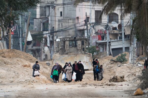 Residents of the West Bank refugee camp of Nur Shams, Tulkarem, evacuate their homes as the Israeli military continues its operation in the area on Tuesday, Feb. 11, 2025. (AP Photo/Majdi Mohammed)