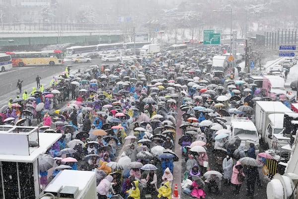 Supporters of impeached South Korean President Yoon Suk Yeol attend a Sunday service as they gather to oppose his impeachment near the presidential residence in Seoul, South Korea, Sunday, Jan. 5, 2025. (AP Photo/Ahn Young-joon)