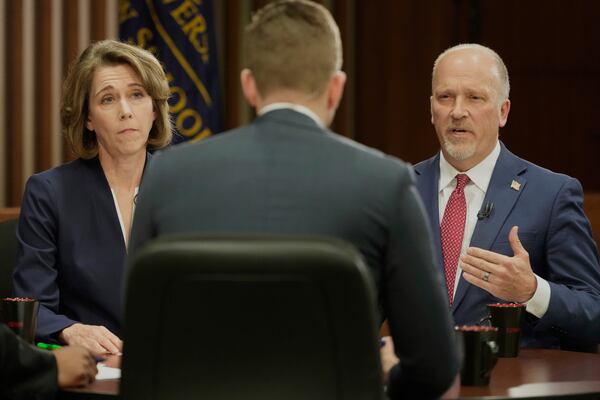 Wisconsin Supreme Court candidates Brad Schimel and Susan Crawford participate in a debate Wednesday, March 12, 2025, in Milwaukee. (AP Photo/Morry Gash)