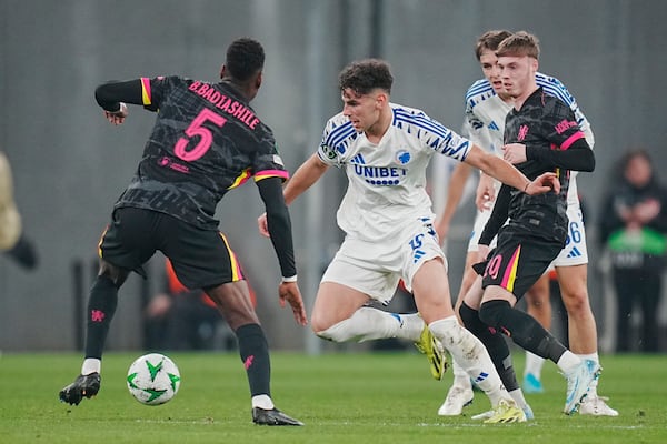 Copenhagen's Amin Chiakha in action with Chelsea's Benoit Badiashile, left, and Cole Palmer during the Conference League round of 16 soccer match between FC Copenhagen and Chelsea FC at Parken Stadium in Copenhagen, Denmark, Thursday March 6, 2025. (Liselotte Sabroe/Ritzau Scanpix via AP)