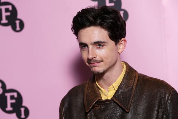 Timothee Chalamet poses for photographers upon arrival at the photo call for an 'In Conversation' event at the BFI Southbank, on Wednesday, Dec. 18, 2024, in London. (Photo by Scott A Garfitt/Invision/AP)