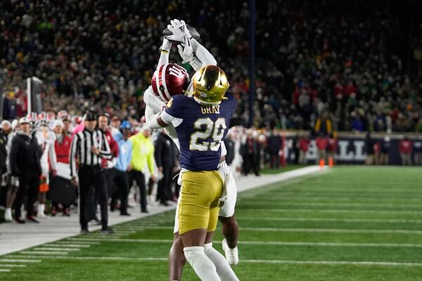 Indiana wide receiver Omar Cooper Jr. (3) catches a 23-yard touchdown pass as Notre Dame cornerback Christian Gray (29) defends during the second half in the first round of the NCAA College Football Playoff, Friday, Dec. 20, 2024, in South Bend, Ind. (AP Photo/Darron Cummings)