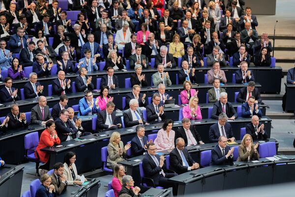 Leader of the Christian Democrats Friedrich Merz, third from right, listens to a debate iahead of a second round of vote at the German federal parliament, Bundestag, at the Reichstag building in Berlin, Germany, Tuesday, May 6, 2025. (AP Photo/Markus Schreiber)
