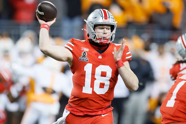 Ohio State quarterback Will Howard throws a pass against Tennessee during the first half in the first round of the College Football Playoff, Saturday, Dec. 21, 2024, in Columbus, Ohio. (AP Photo/Jay LaPrete)