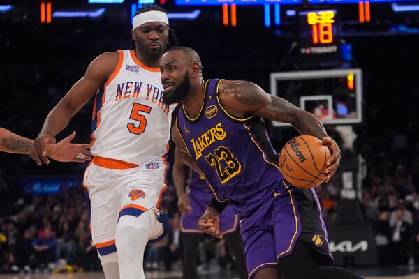 Los Angeles Lakers' LeBron James (23) drives past New York Knicks' Precious Achiuwa (5) during the second half of an NBA basketball game Saturday, Feb. 1, 2025, in New York. (AP Photo/Frank Franklin II)